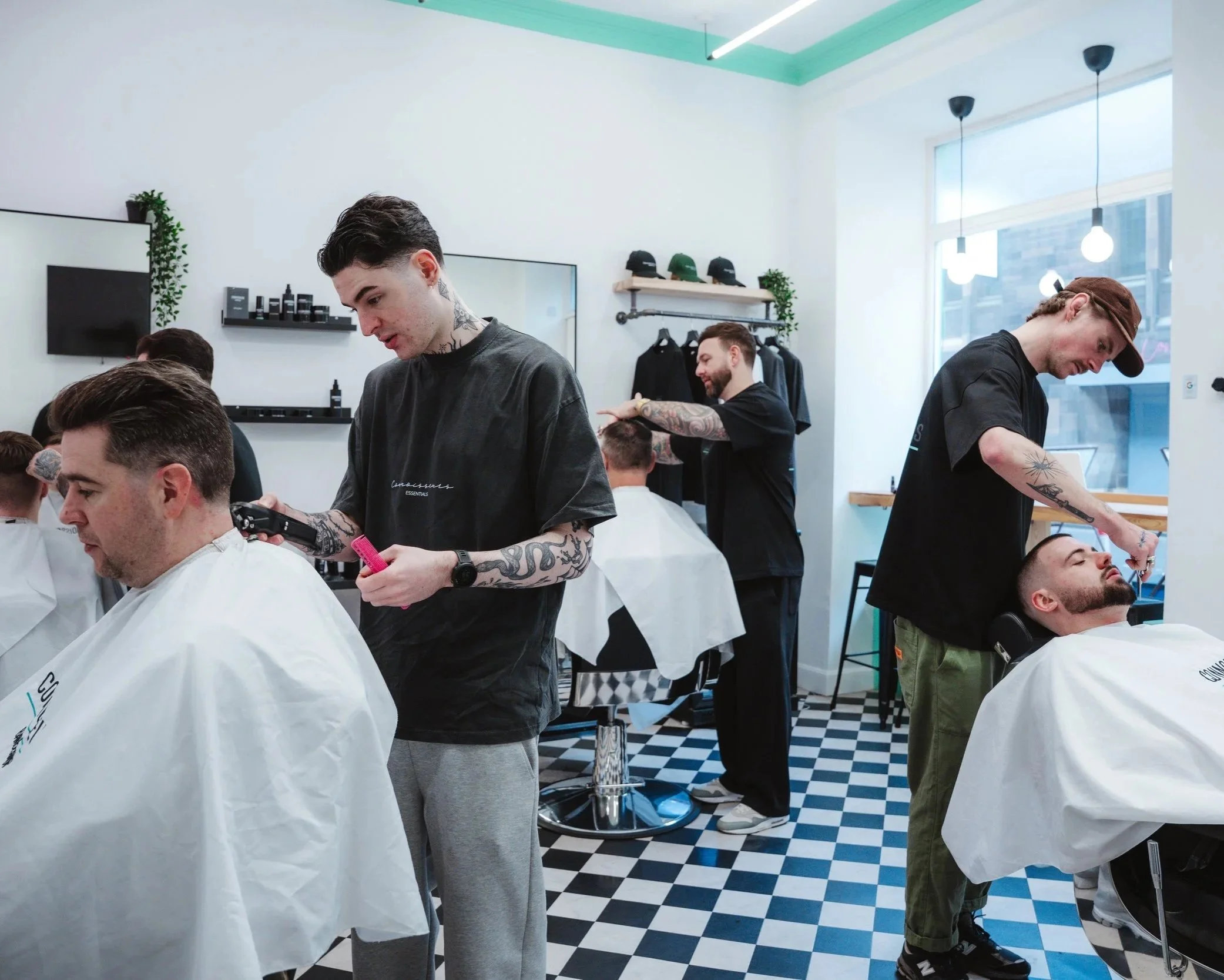 Barber's workstation with professional clippers, scissors, combs, and styling products ready for a haircut