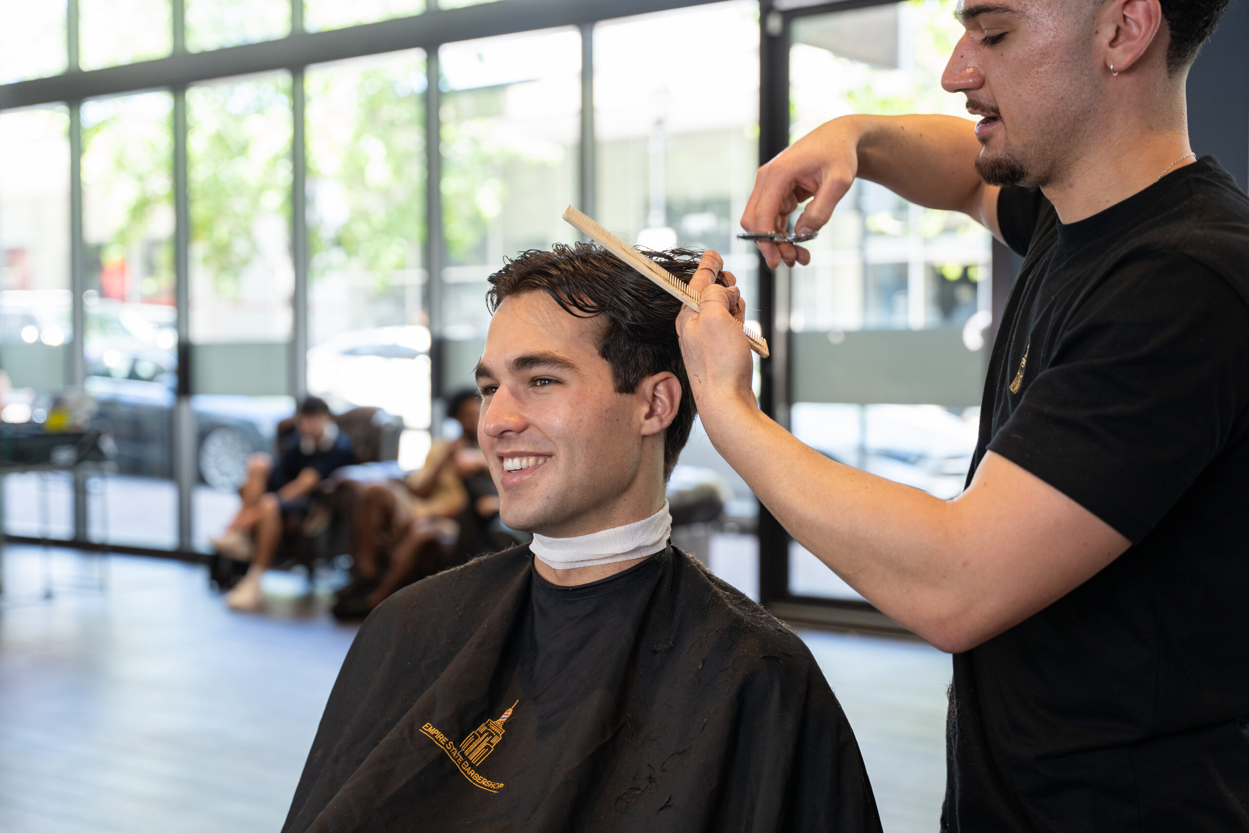 Modern skin fade haircut with a smooth transition from short sides to textured hair